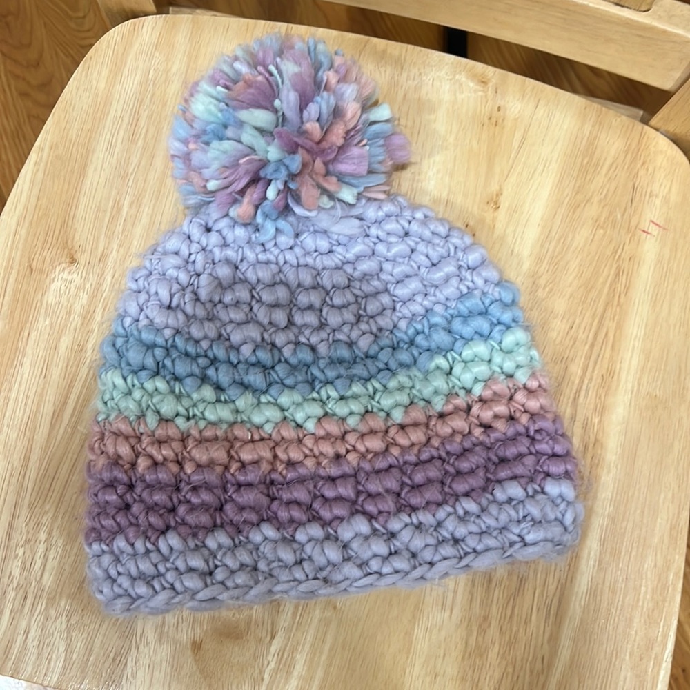 Woman’s, OS, winter hat with tasseled Pom Pom on top. Beautiful mix of colors.